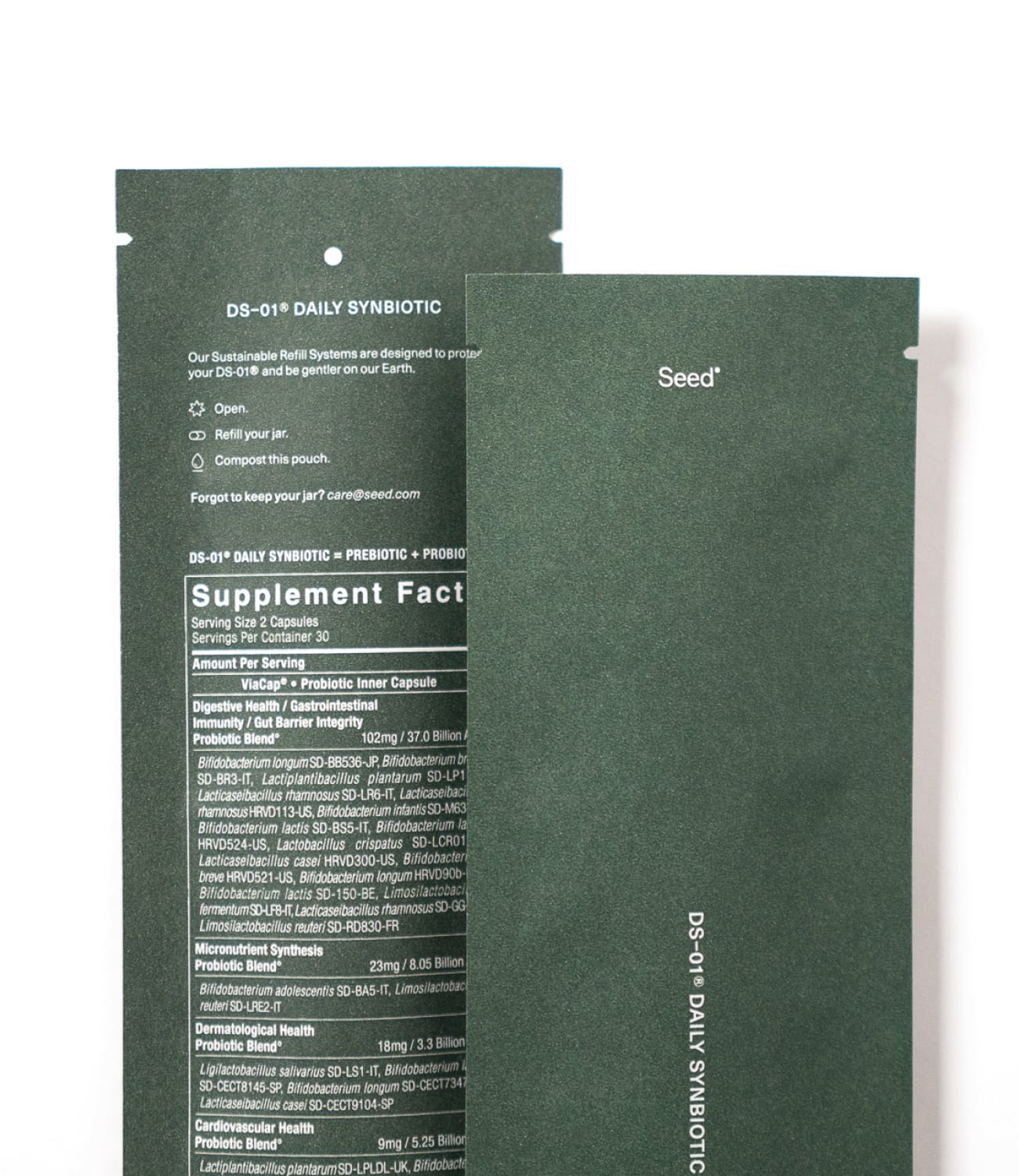 Two dark green Seed DS-01 Daily Synbiotic refill sachets
