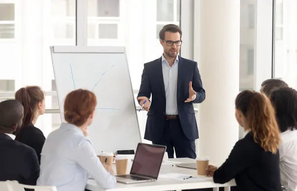 A group of people in a meeting arguing on a  subject wth gesture in a peaceful way