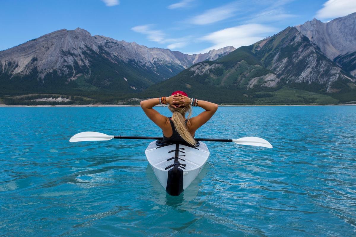 A person kayaking on a lake