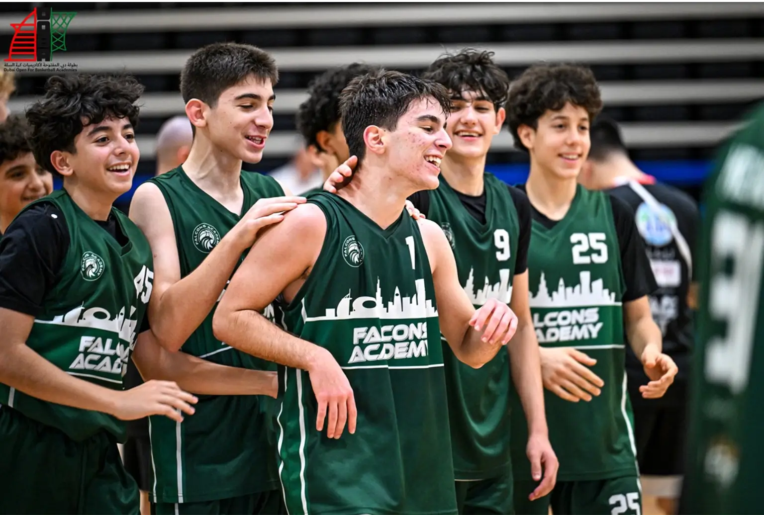 A group of young men standing next to each other on a basketball court.