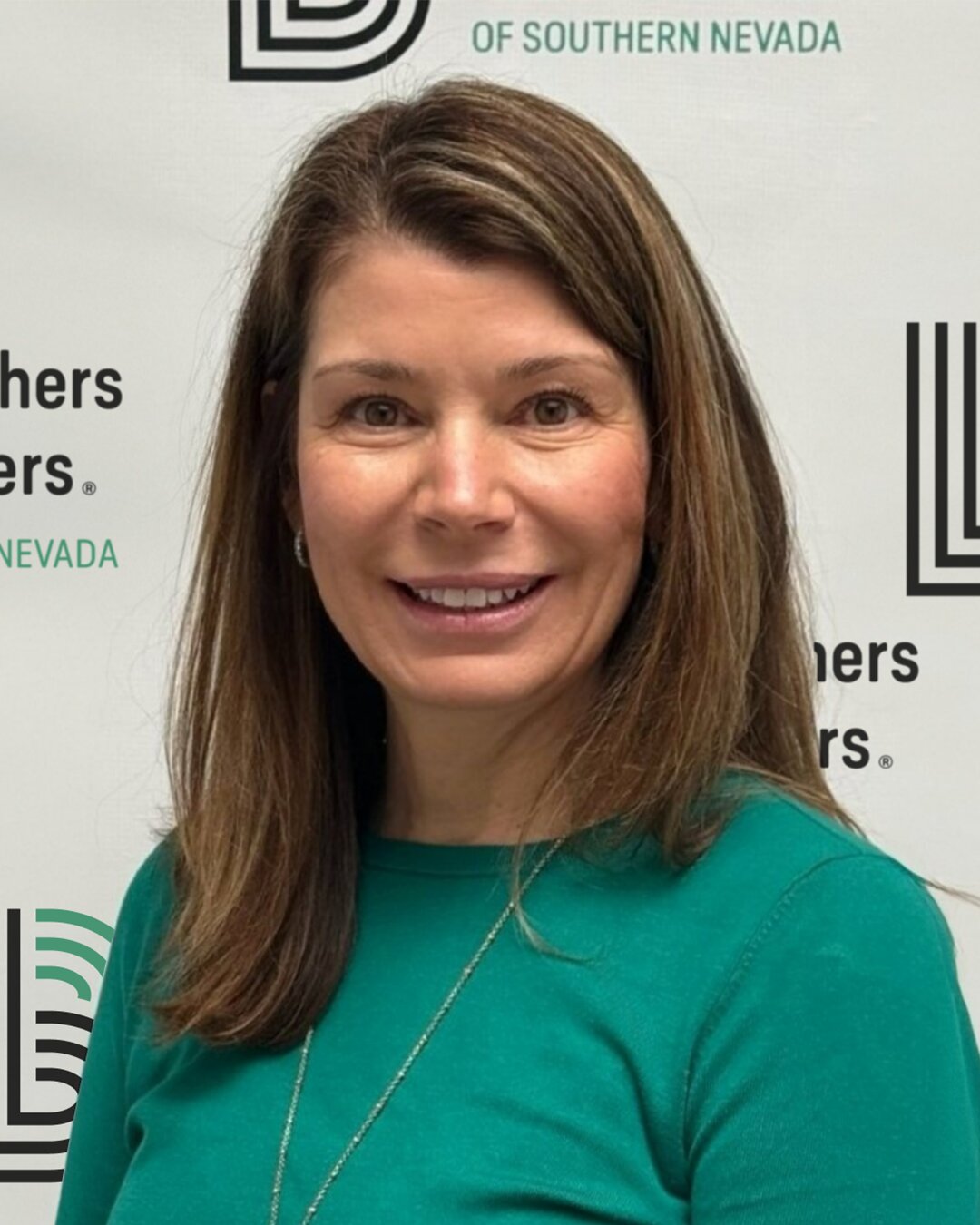 Kelly Schwarz, CEO of Big Brothers Big Sisters of Southern Nevada, smiling and wearing a green top