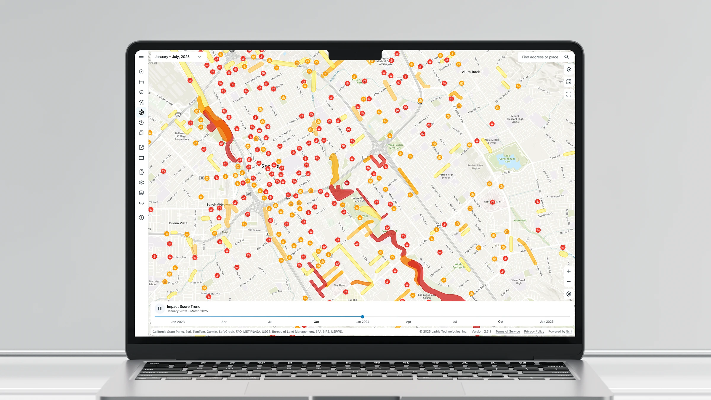 Laptop screen displaying a color-coded map with impact score trends from January 2023 to March 2025 featuring red, orange, and yellow markers and areas.