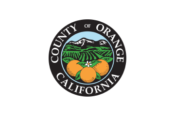 Seal of Orange County, California, featuring three oranges, green hills, and mountains under a blue sky.