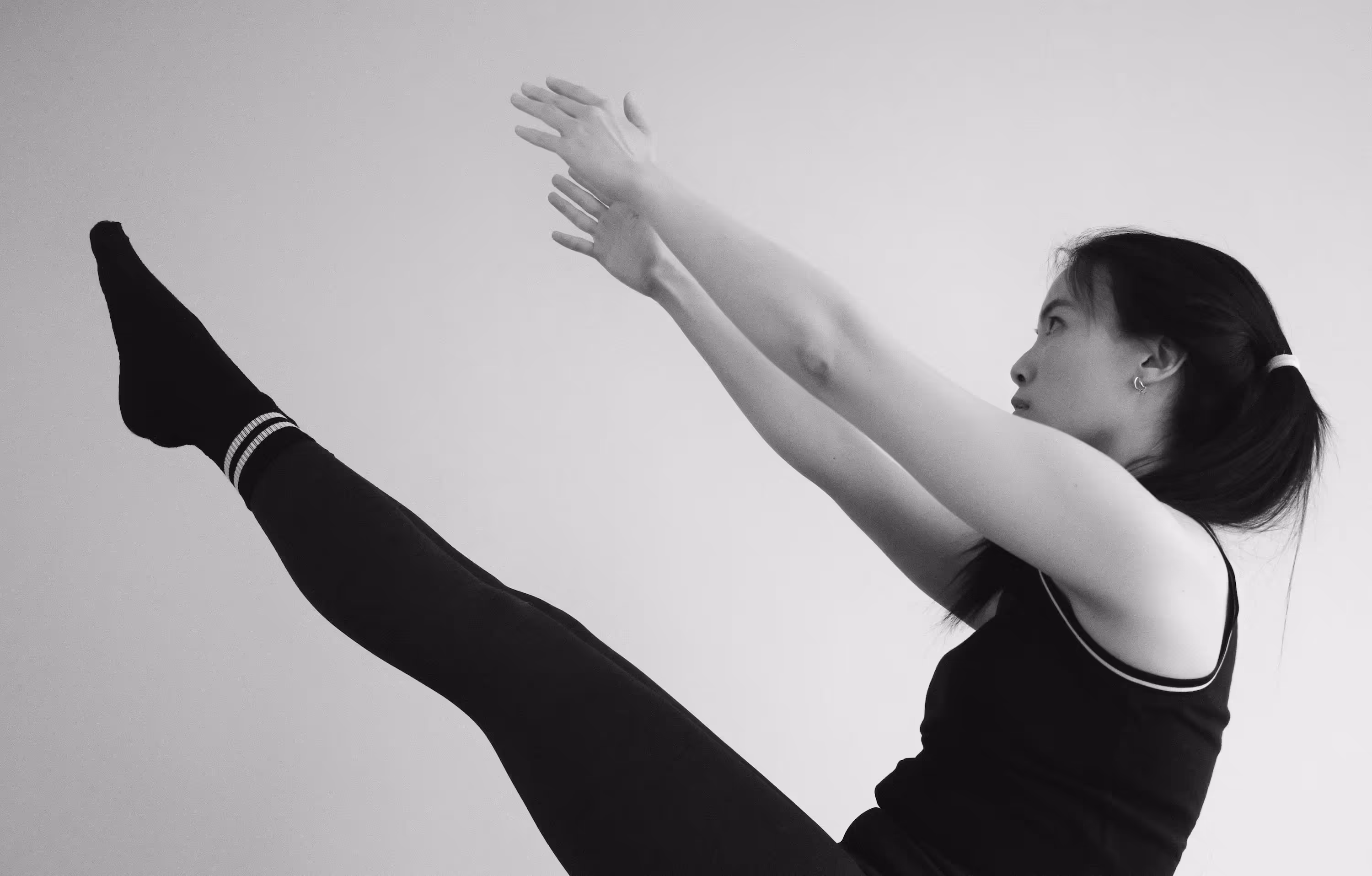 Stylish photo of a woman performing Pilates