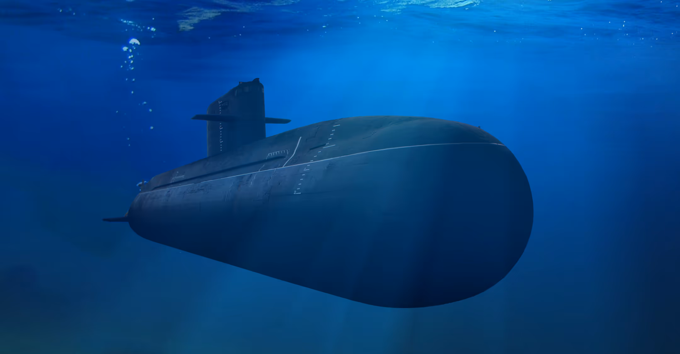 Dark submarine submerged underwater with light rays filtering through the blue ocean.