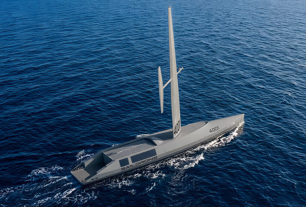 Spectre Silent Endurance Saildrone with wing system sailing on a dark blue ocean