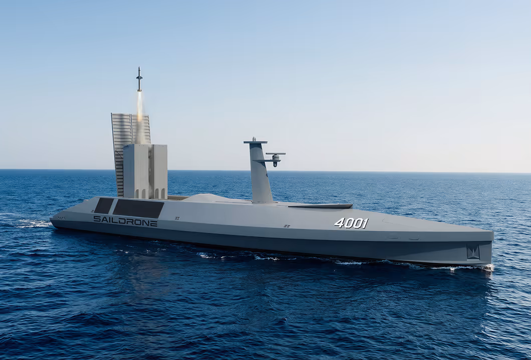 Unmanned Spectre Stealth Strike Saildrone launching a missile over the ocean.