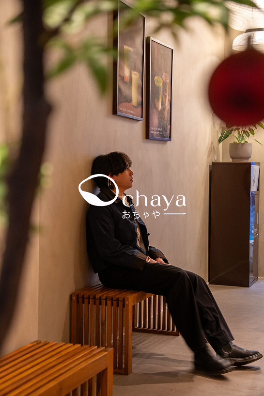 Photo of a man sitting on a bench