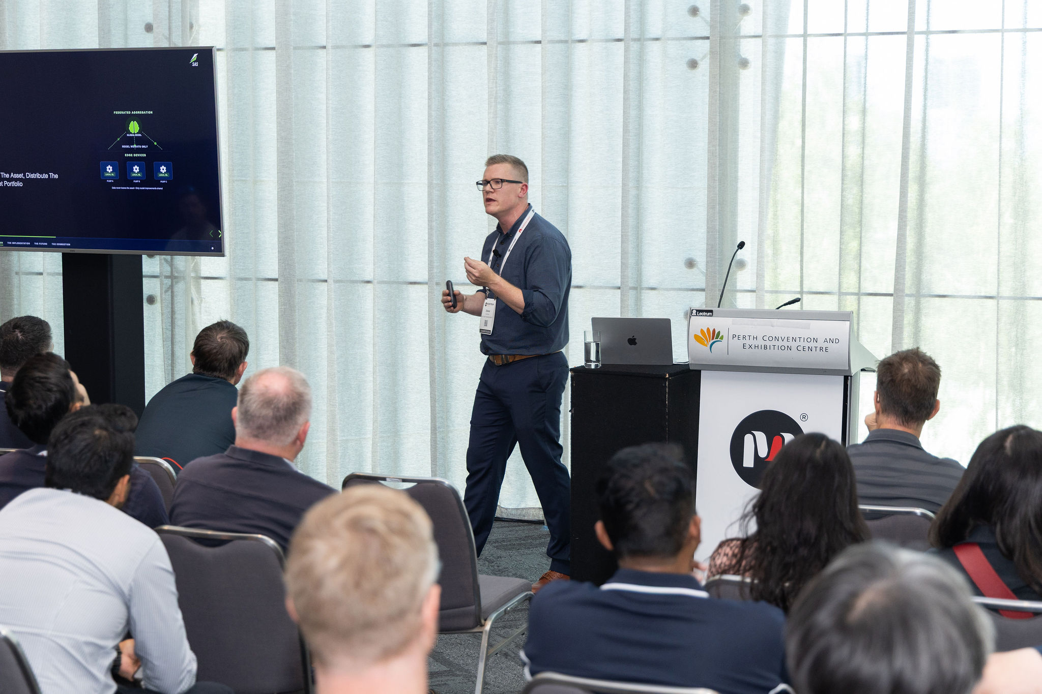 Shane Scriven presenting on edge federated machine learning at the Mainstream Summit 2026, Perth Convention and Exhibition Centre