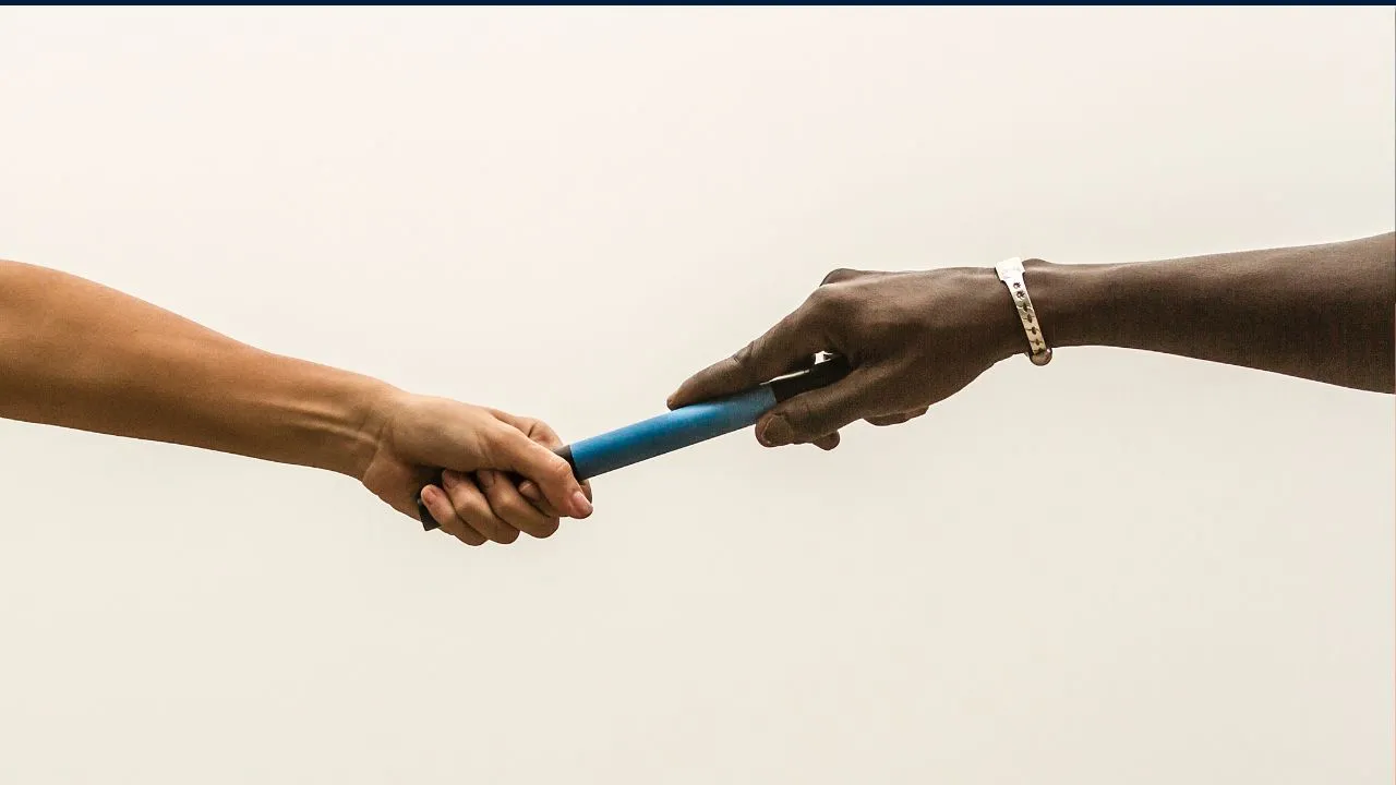 A man is holding a blue pole. - The Fellowship Images