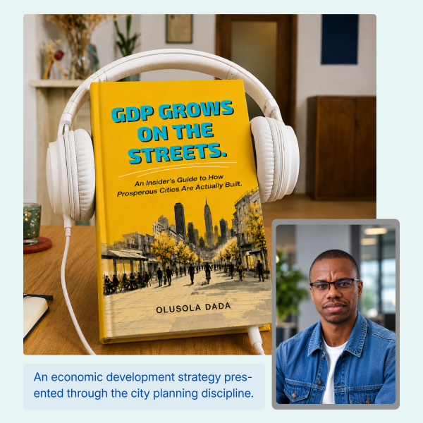 Yellow book titled 'GDP Grows on the Streets' with white headphones around it on a wooden desk.