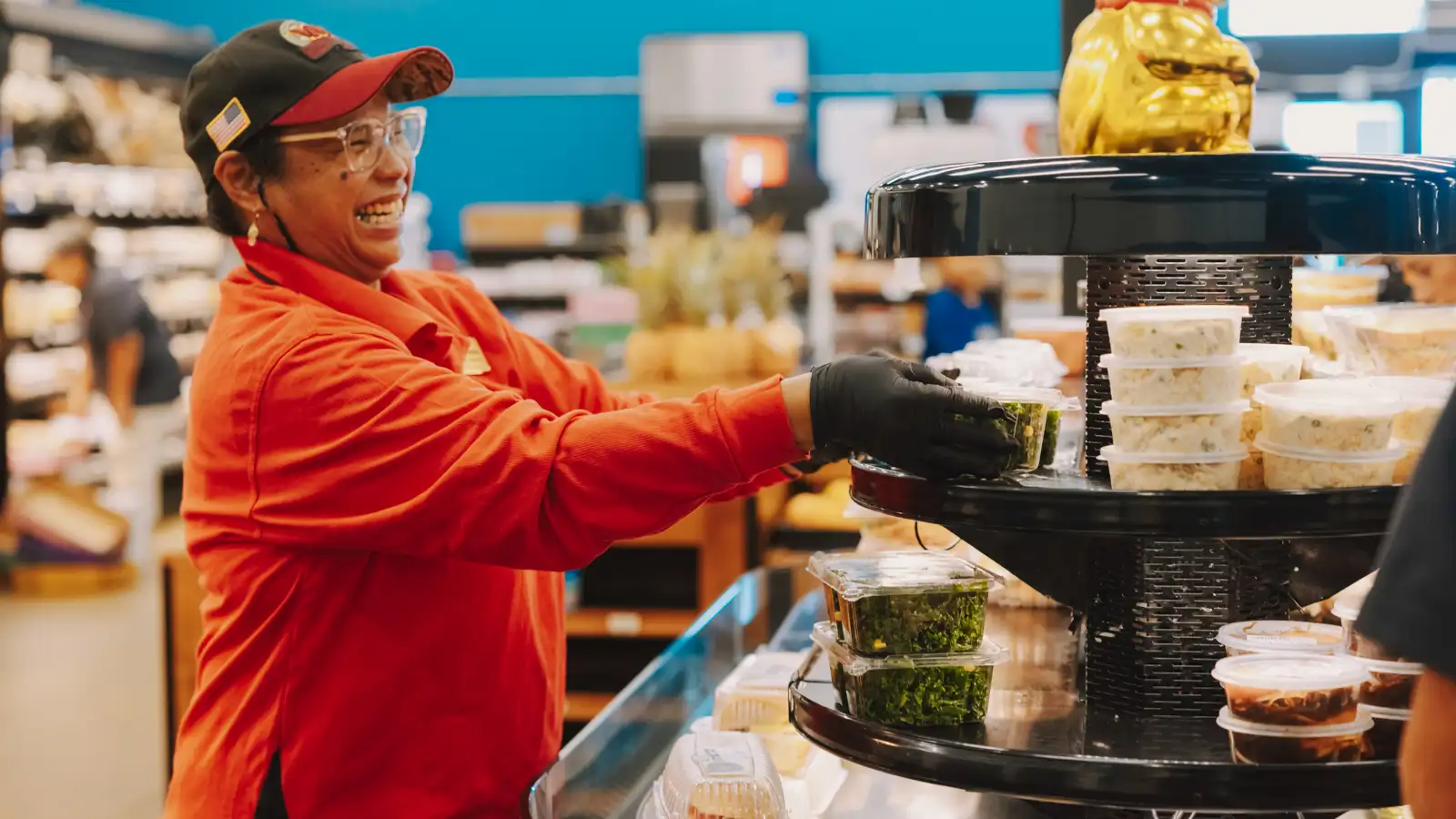 Staff stocking food at Matsuyama Food and Fuel