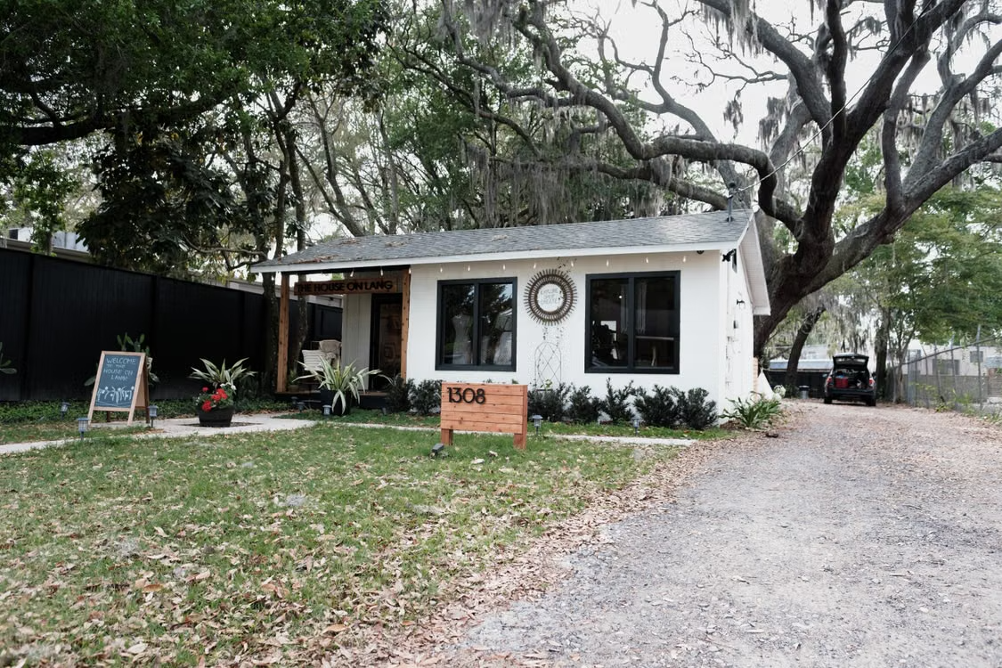 Single-story home surrounded by large trees, representing a property covered under Orlando home insurance.