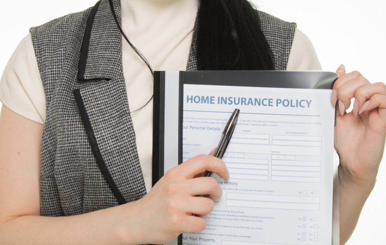 Person reviewing and signing a Fort Lauderdale home insurance policy quote
