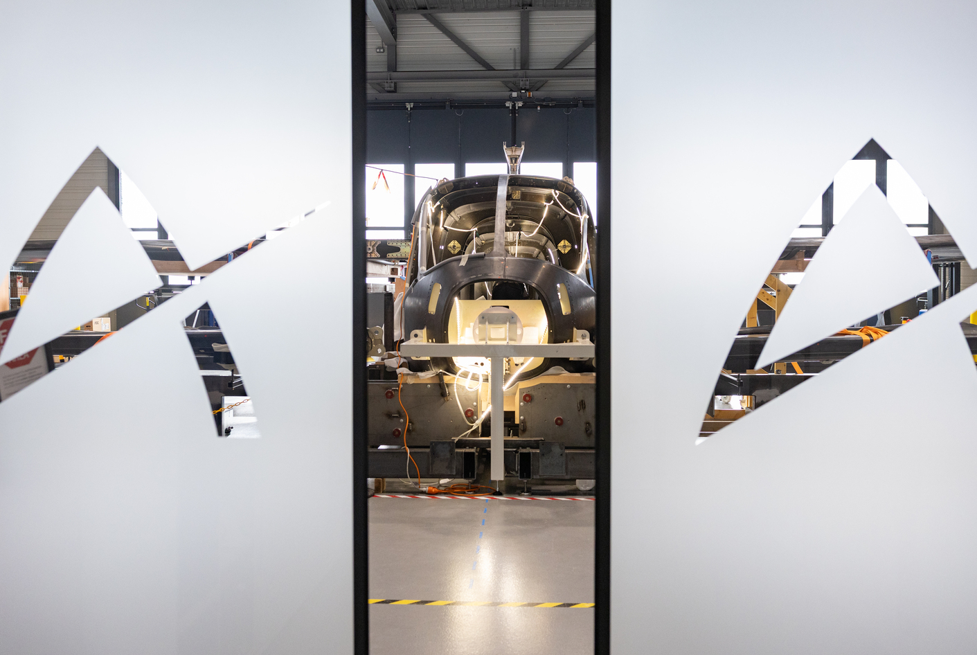 View through the doors of Ascendance's facility onto the Atea aircraft in assembly