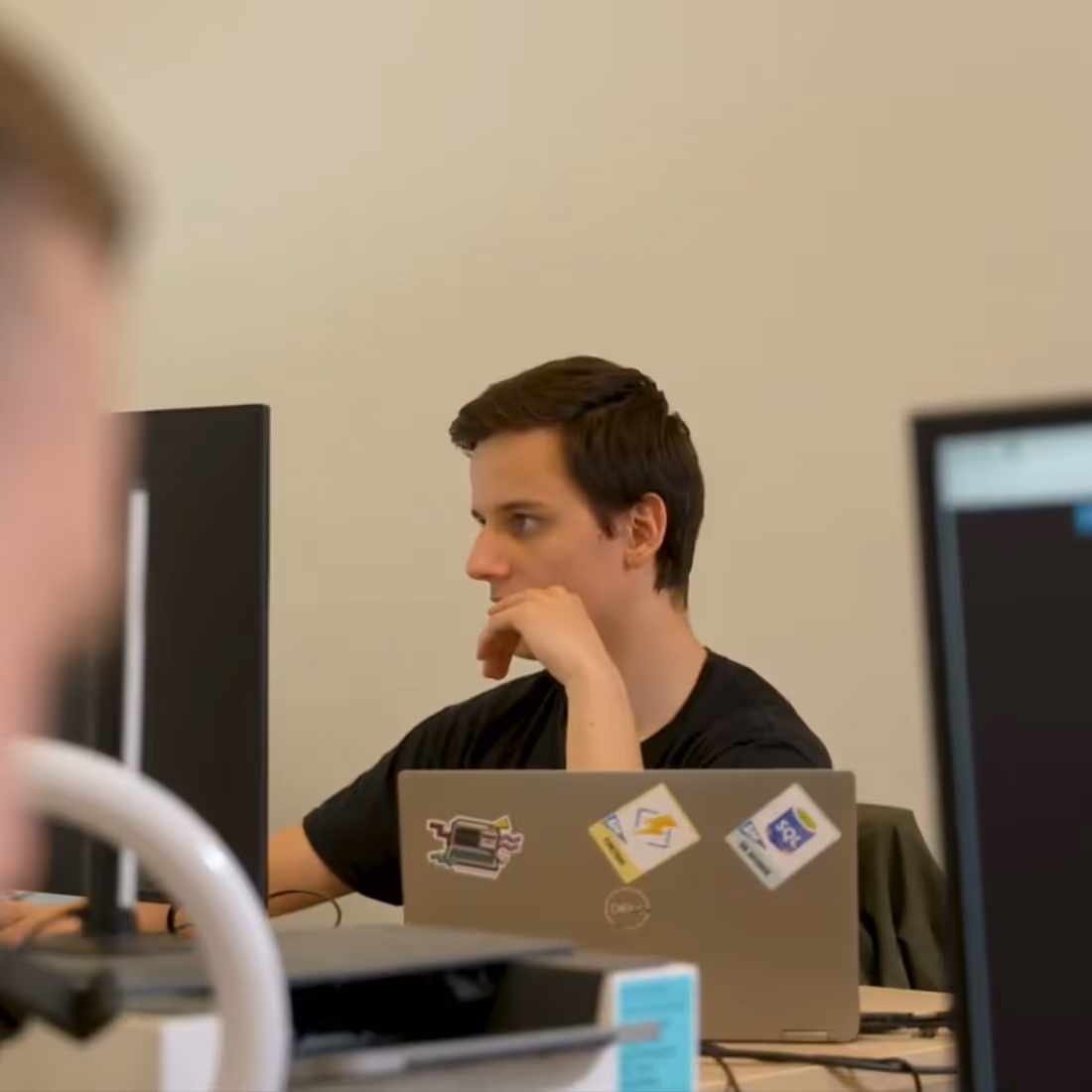 Digital Bricks team member working at a laptop in the office