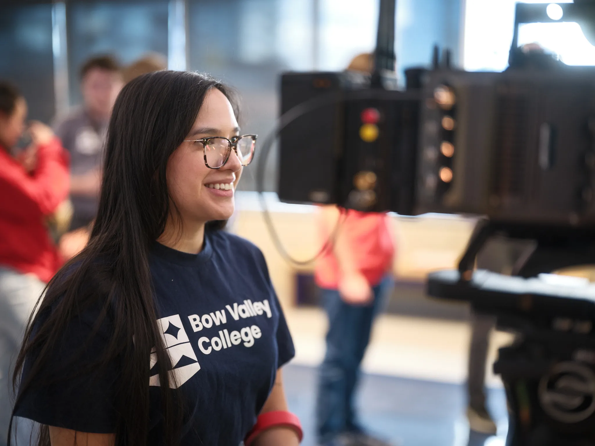 A Bow Valley College staff member smiling as she is being interviewed.