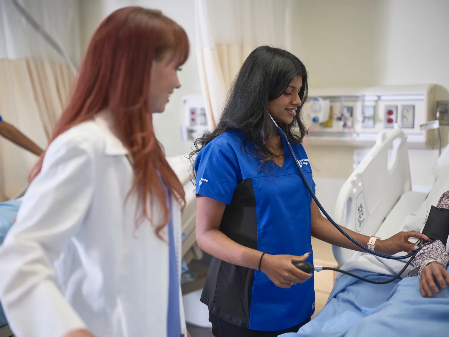 An instructor and a student learning real-world experience 