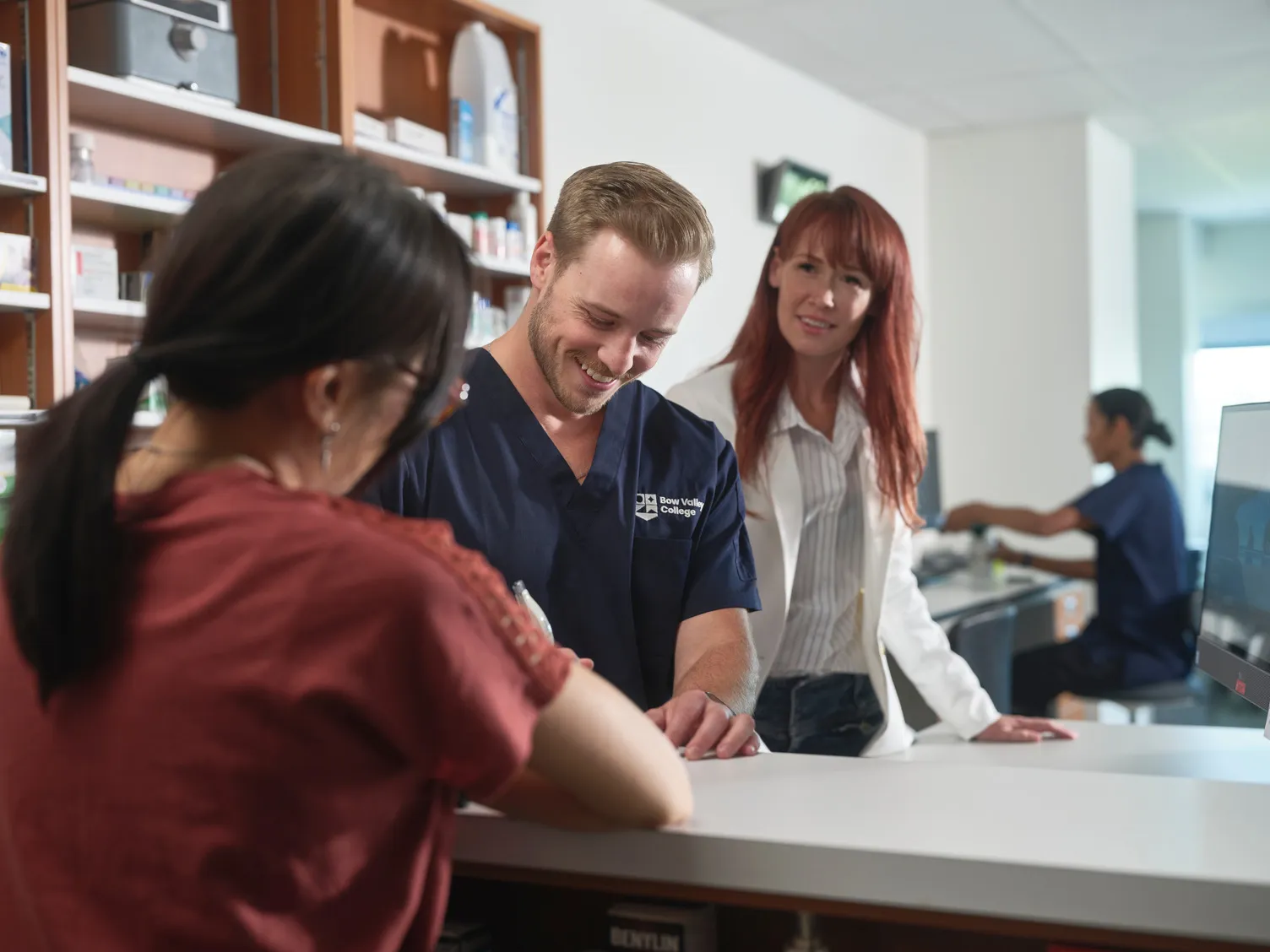 Students learning real life experience in a pharmacy setting