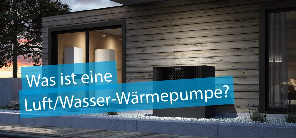Titelbild "Was ist eine Luft/Waser-Wärmepumpe?" - im Bild eine schwarze Luft/Wasserwärmepumpe vor einer Hauswand