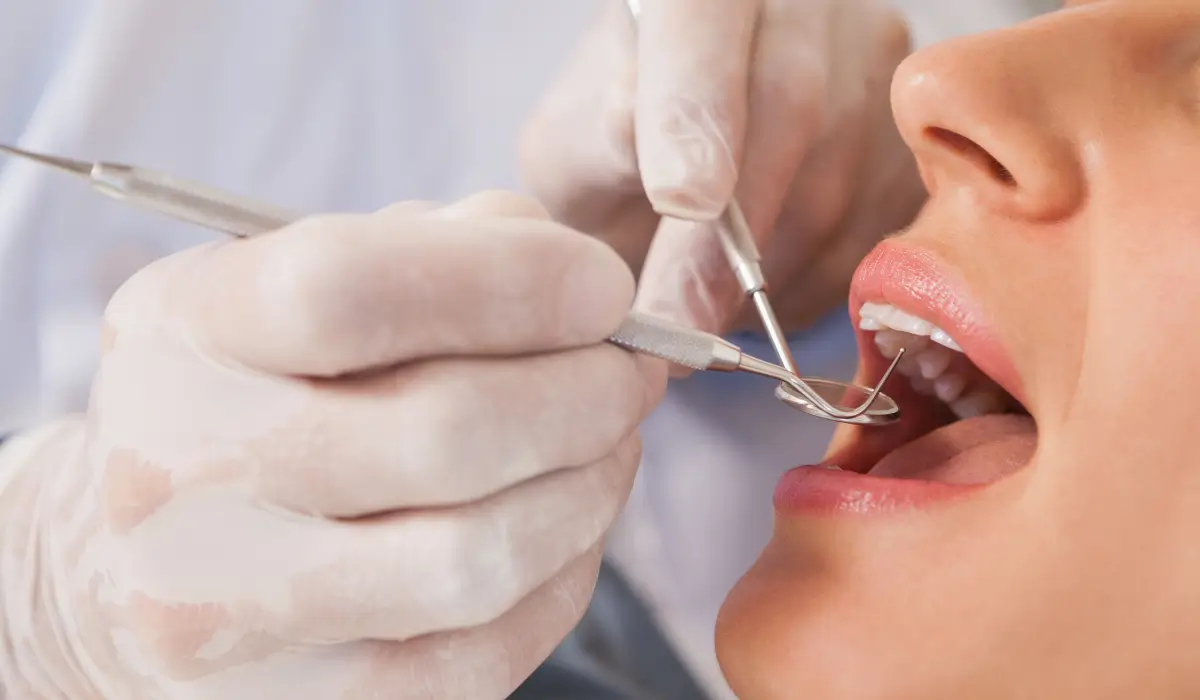 Dentist examining patient’s gums for gum disease