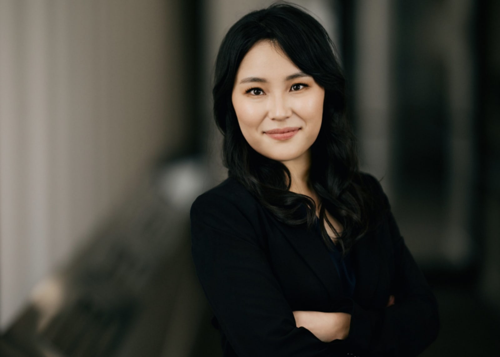 Professional female dentist with arms crossed, smiling confidently
