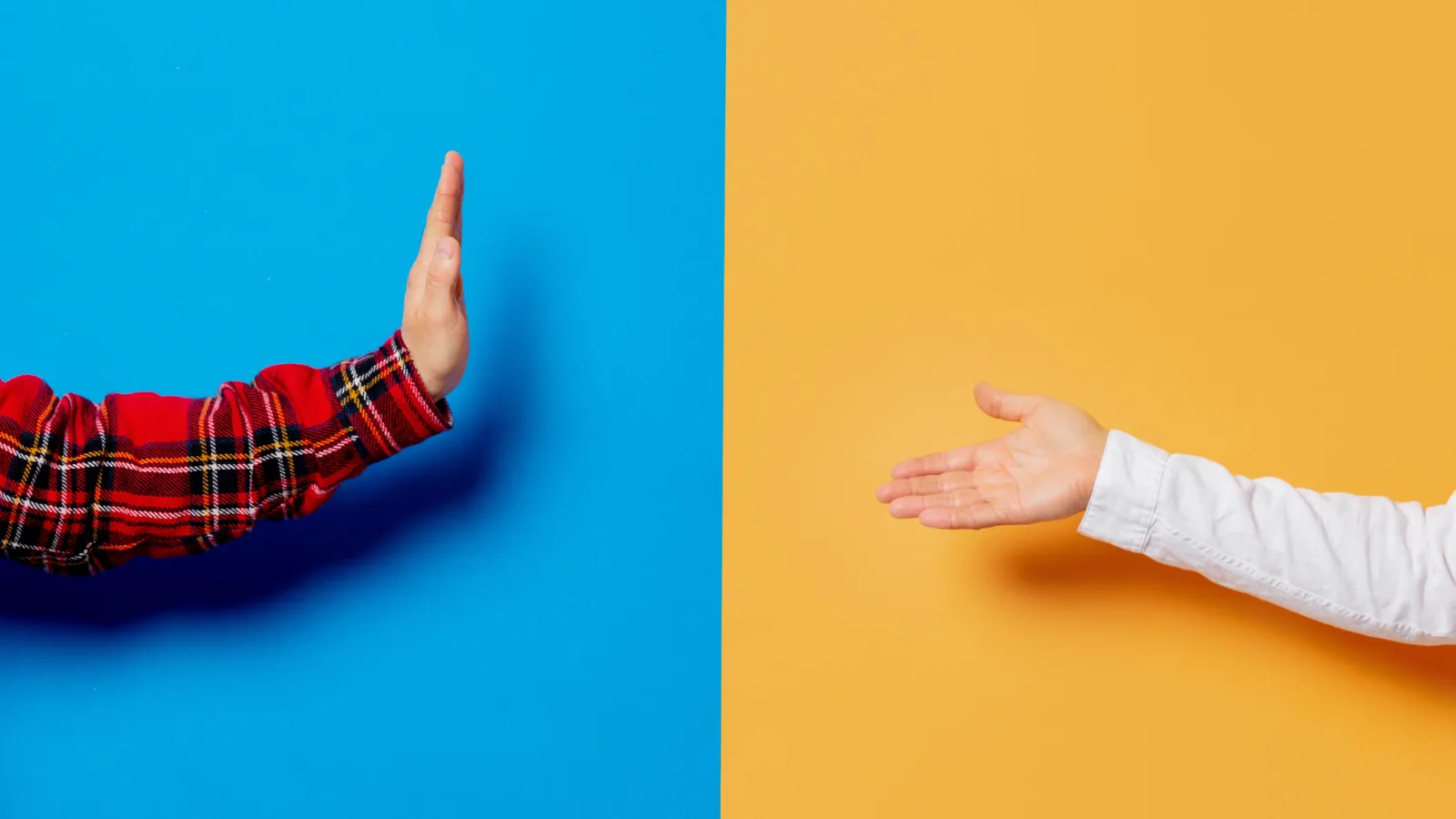 Two outstretched hands separated by a blue and yellow background.