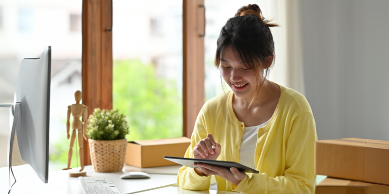Broker on tablet referring clients to Bizcap