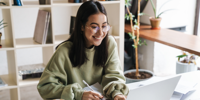 Woman using laptop to apply for low doc loan