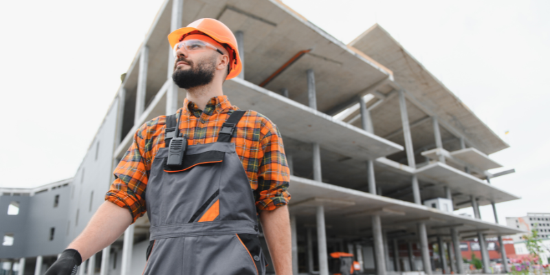 Commercial property services provider business owner wearing construction outfit