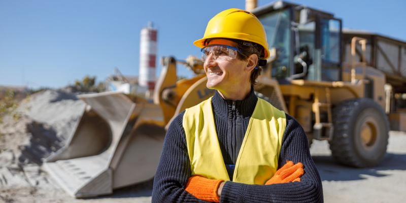Construction business owner with truck in the background