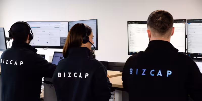 Bizcap employees on the phone informing small business owners about changes to Fast business loan limits