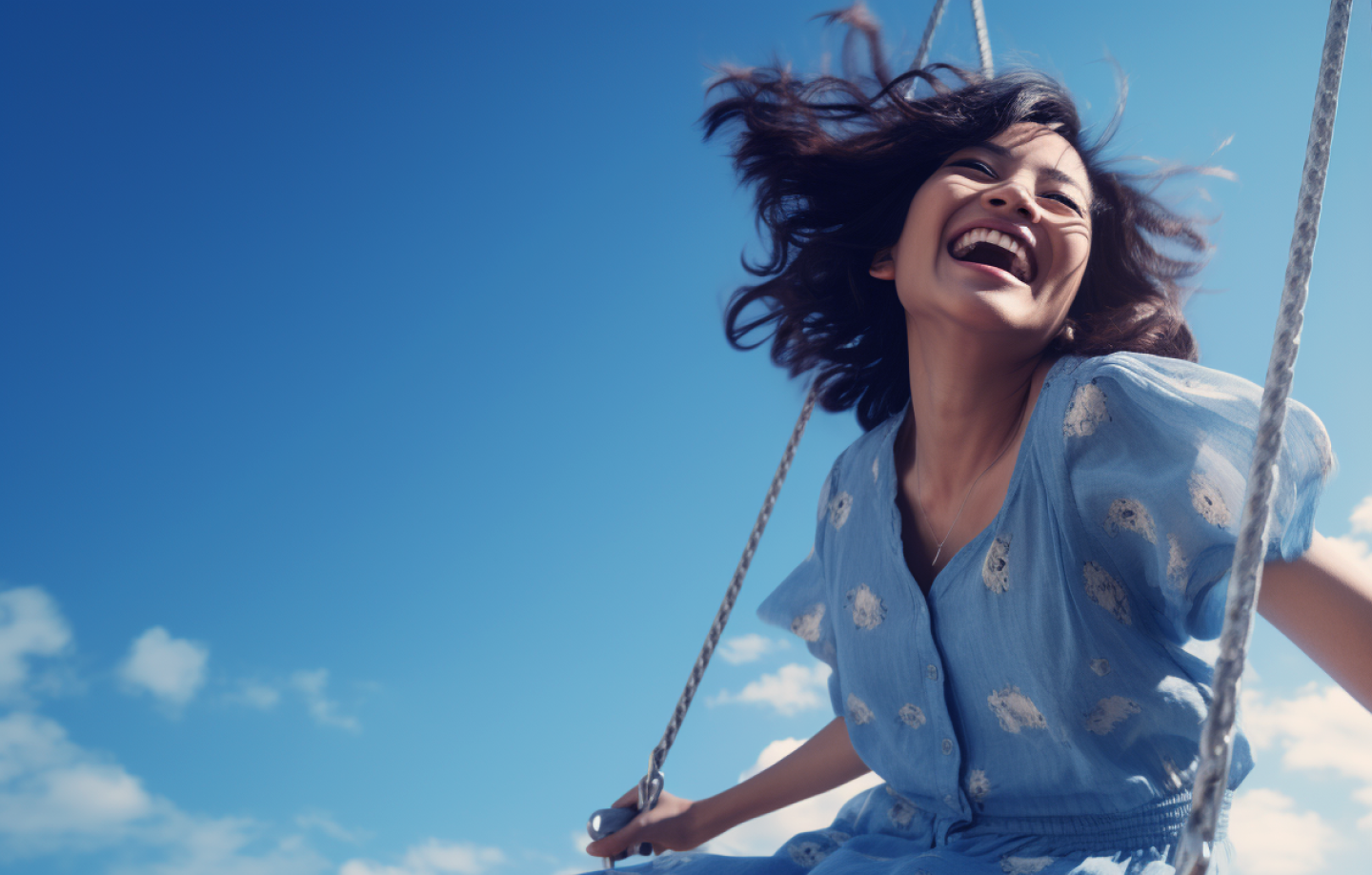 A woman joyfully swinging on a swing, relishing the carefree moment of pure bliss and freedom.