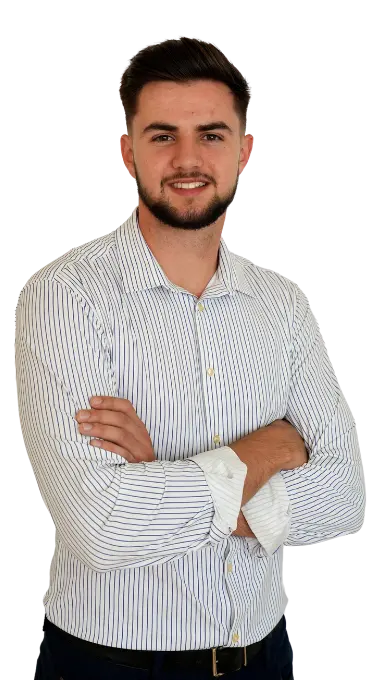 A man with his arms crossed wearing a striped shirt.