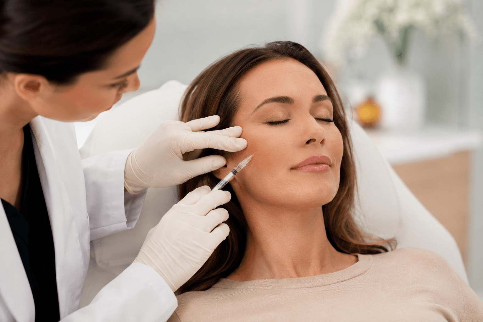 Provider performing Sculptra treatment for skin rejuvenation in Charlotte, North Carolina aesthetic clinic