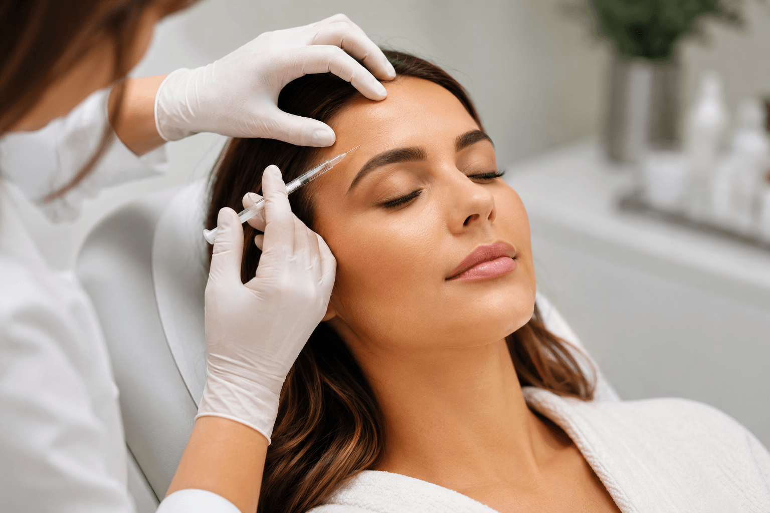 Provider performing Botox treatment on forehead at an aesthetic clinic in Charlotte, North Carolina