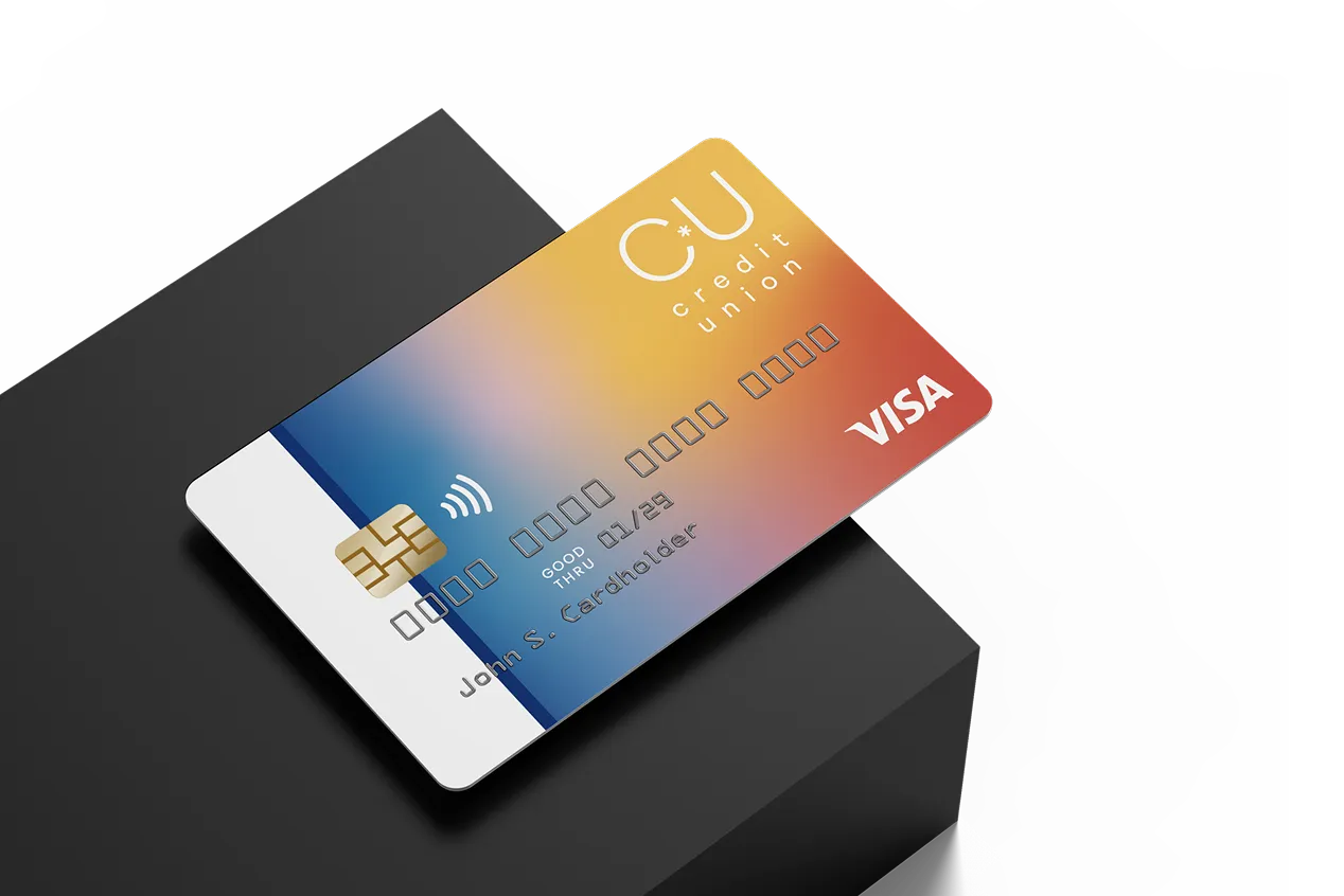A credit card sitting on top of a black box.