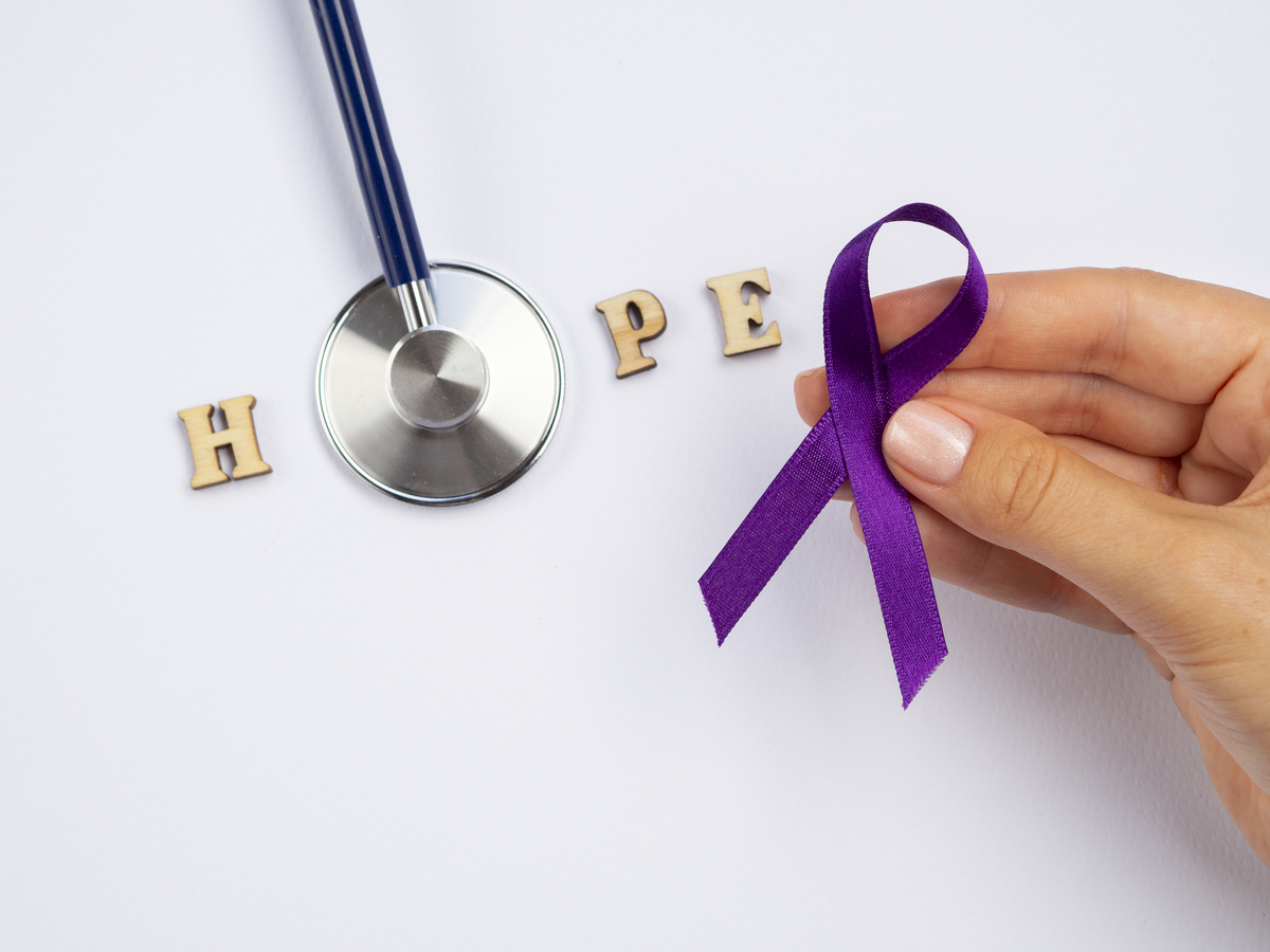 Stethoscope and purple ribbon symbolizing hope