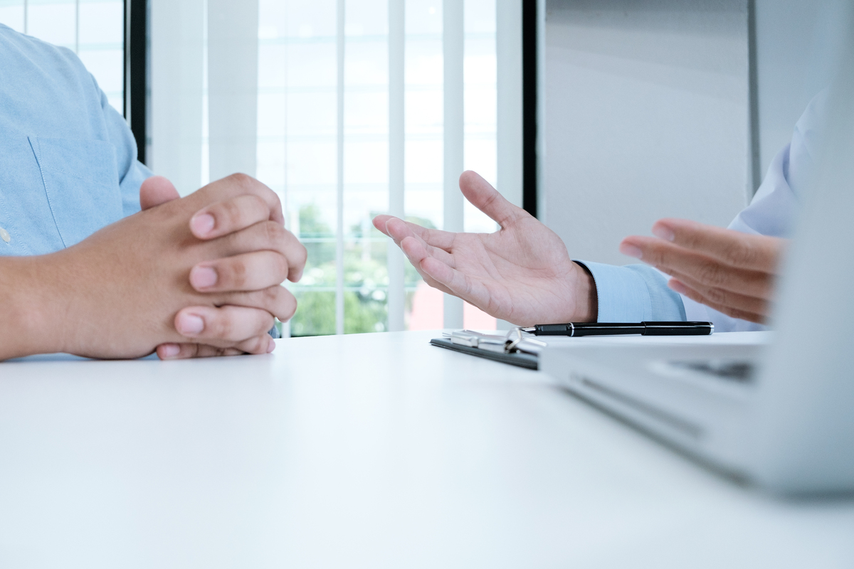 Integrated Oncologist counseling patient
