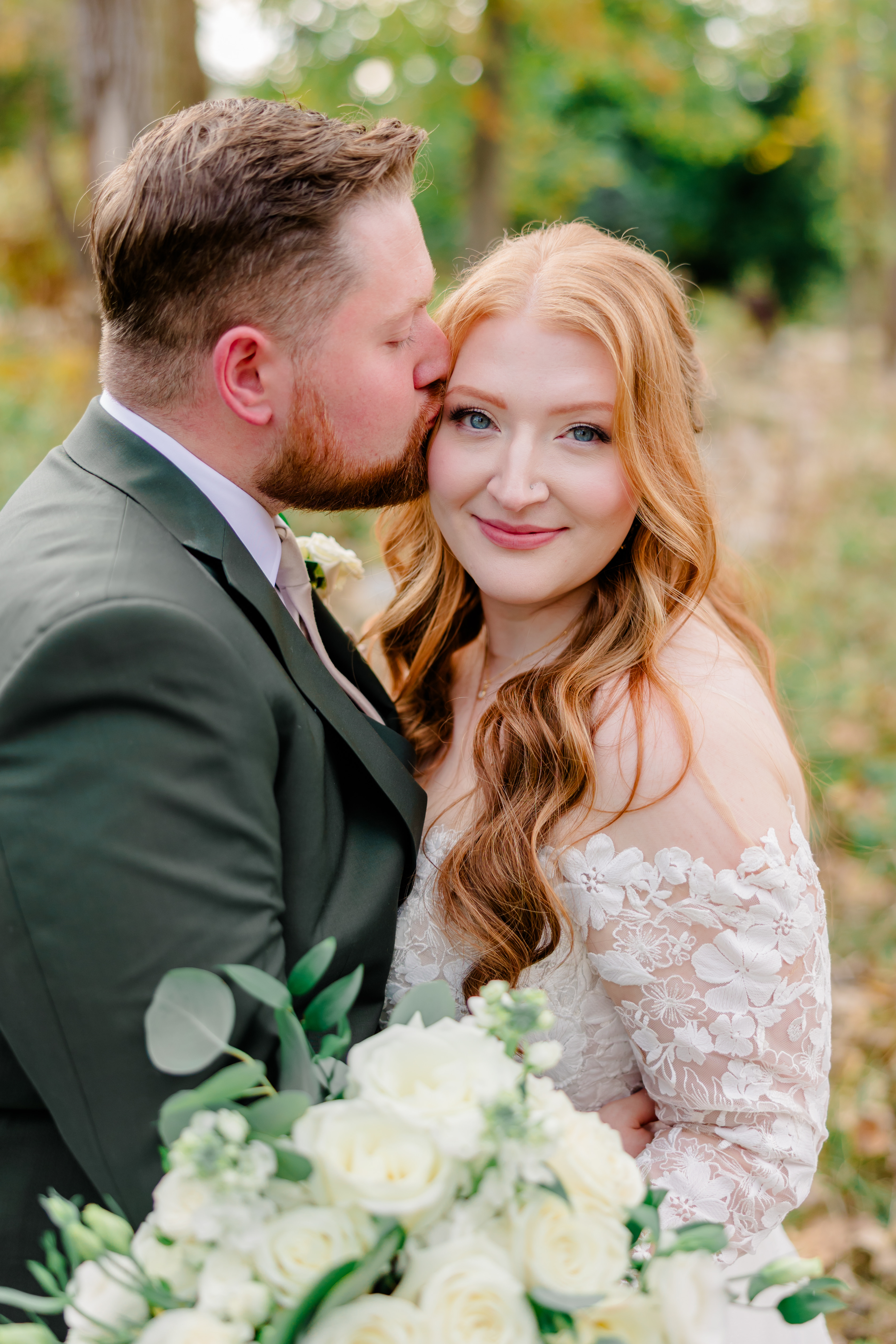 bride and bridesmaids smiling on wedding day.