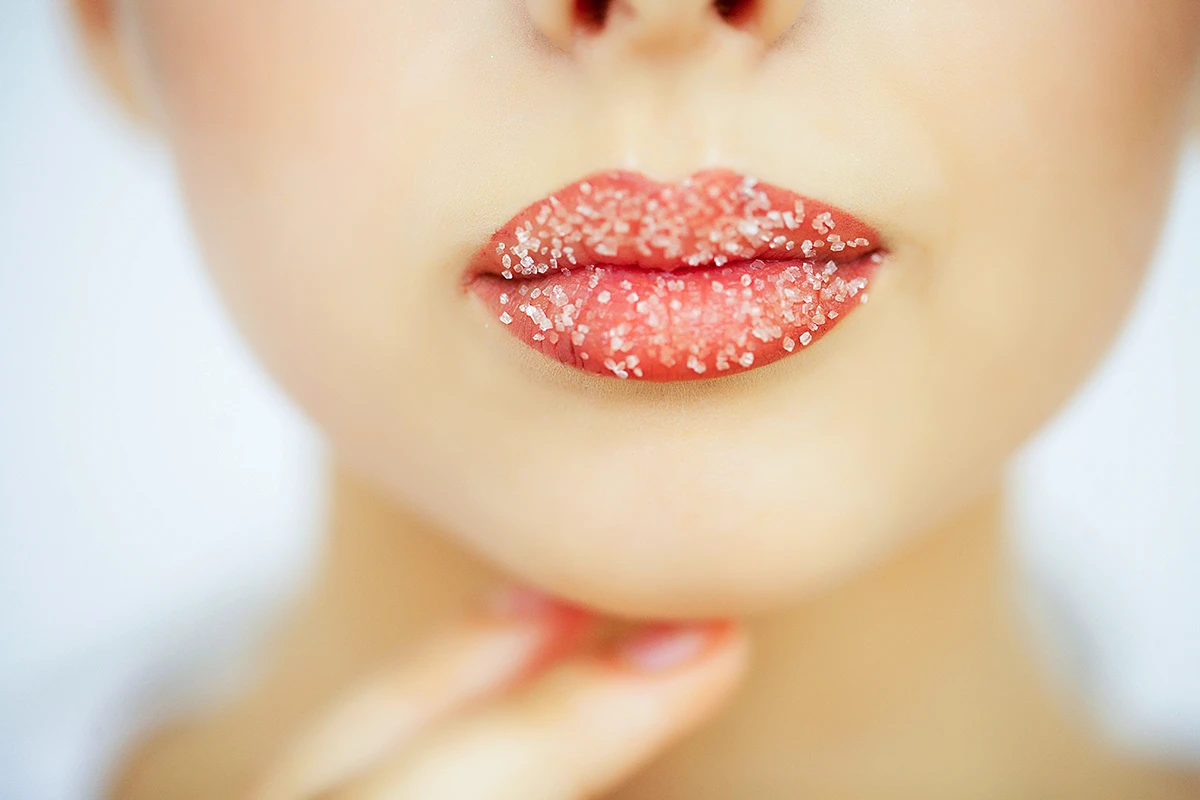 Close-up of wedding day lipstick on a bride’s sugary lips.