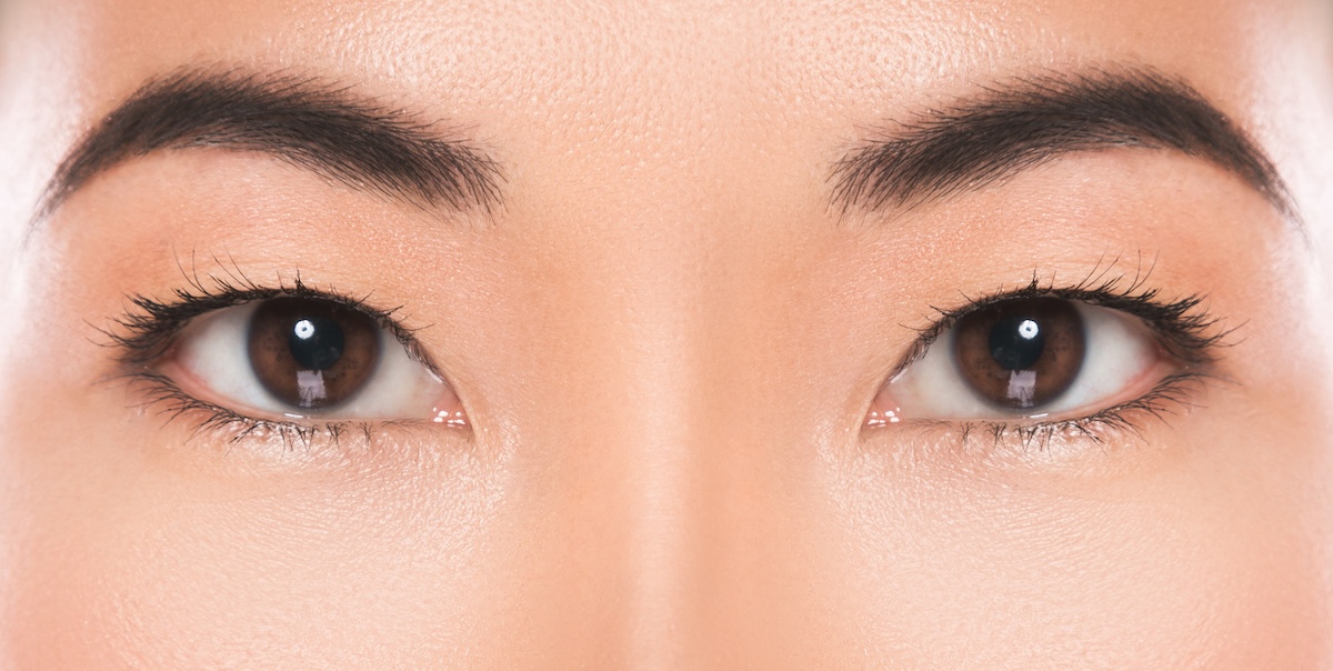 Close-up of Asian woman with round face showing best eyebrow shape with high arch.