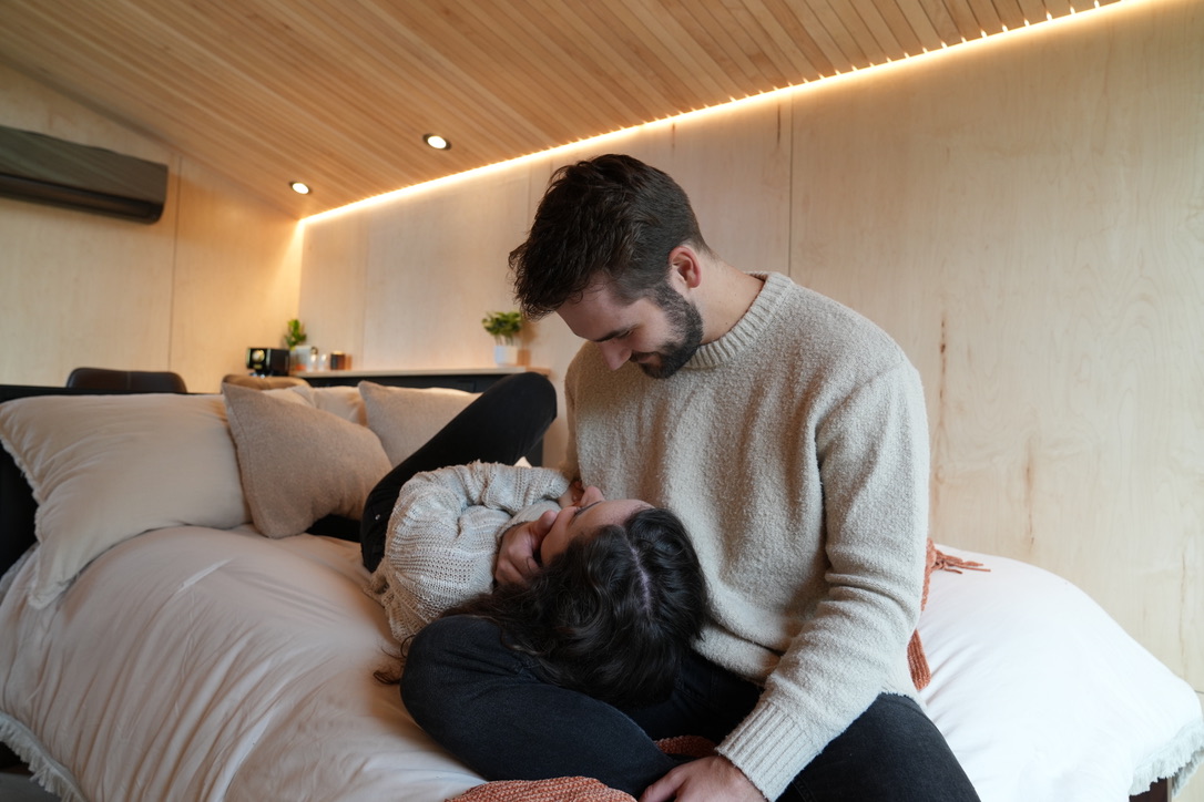 A couple enjoying a wellness retreat in a Wind River adventure dwelling.