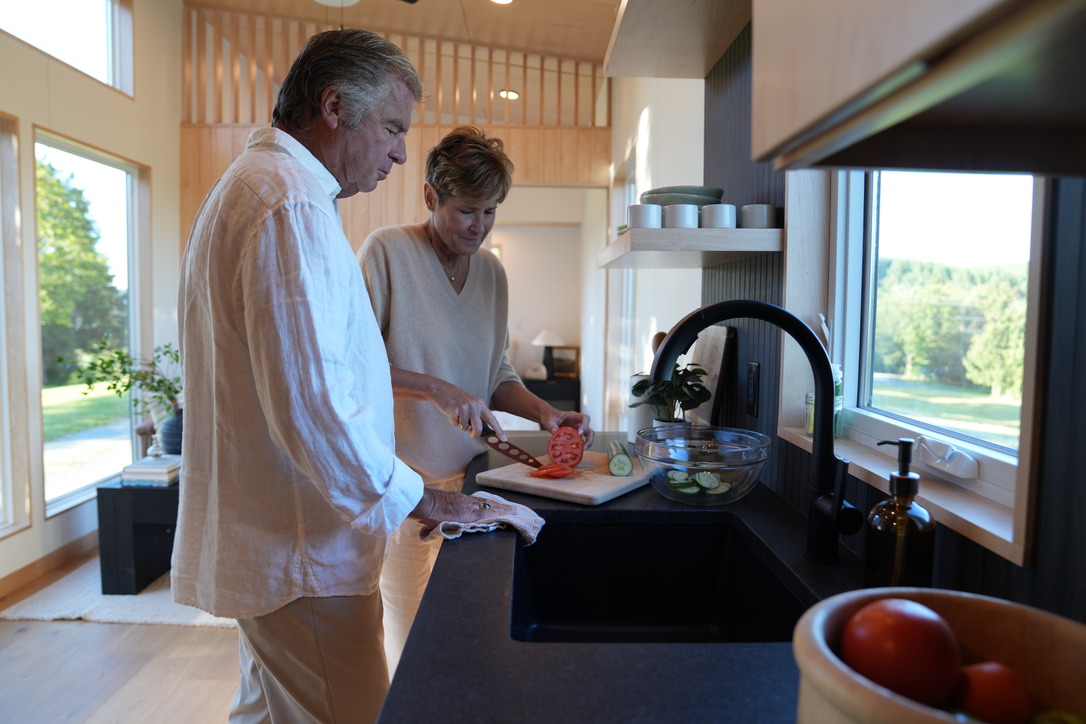 Couple in the kitchen of their Wind River boutique hotel unit.