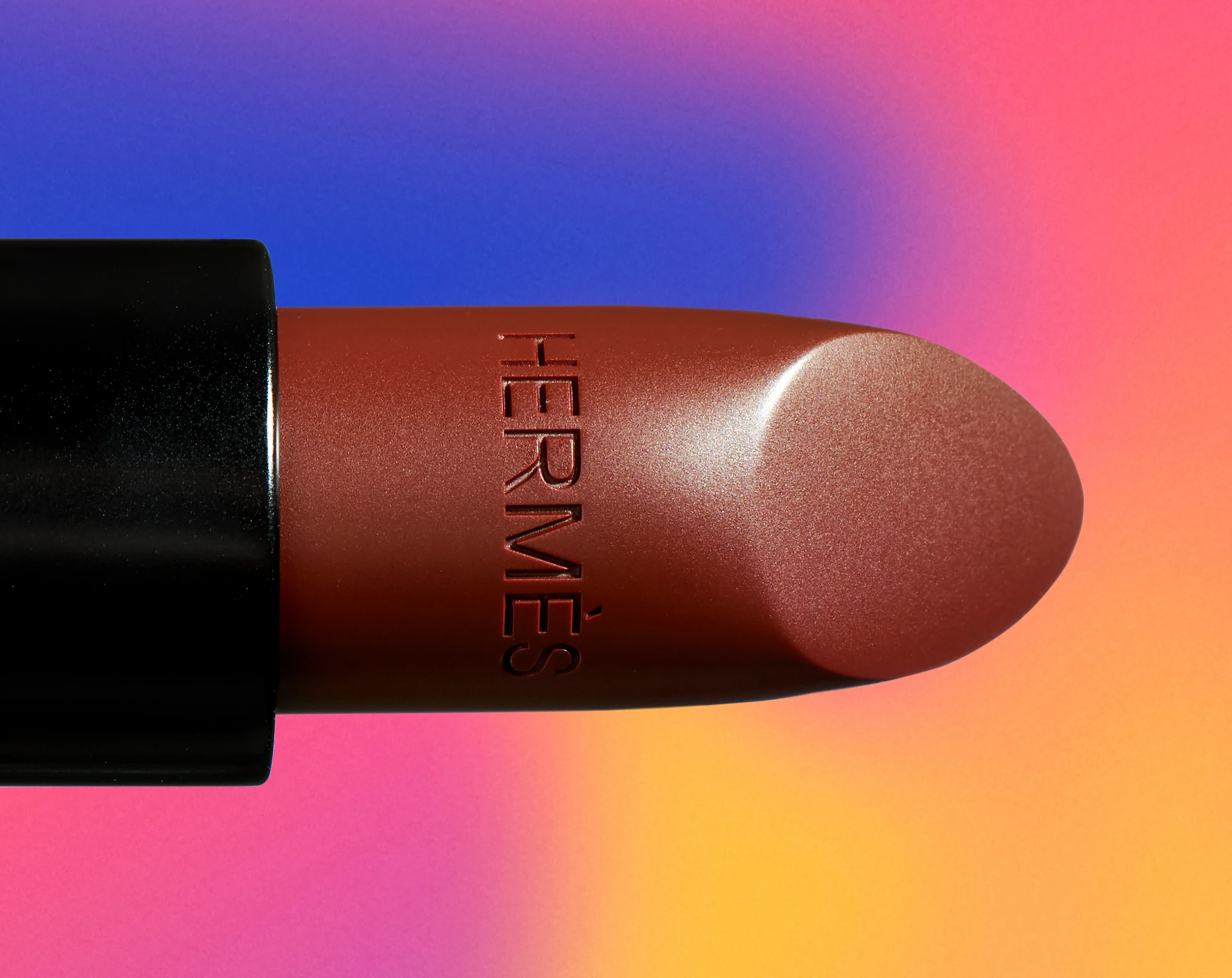A Hermes lipstick in a red shade.