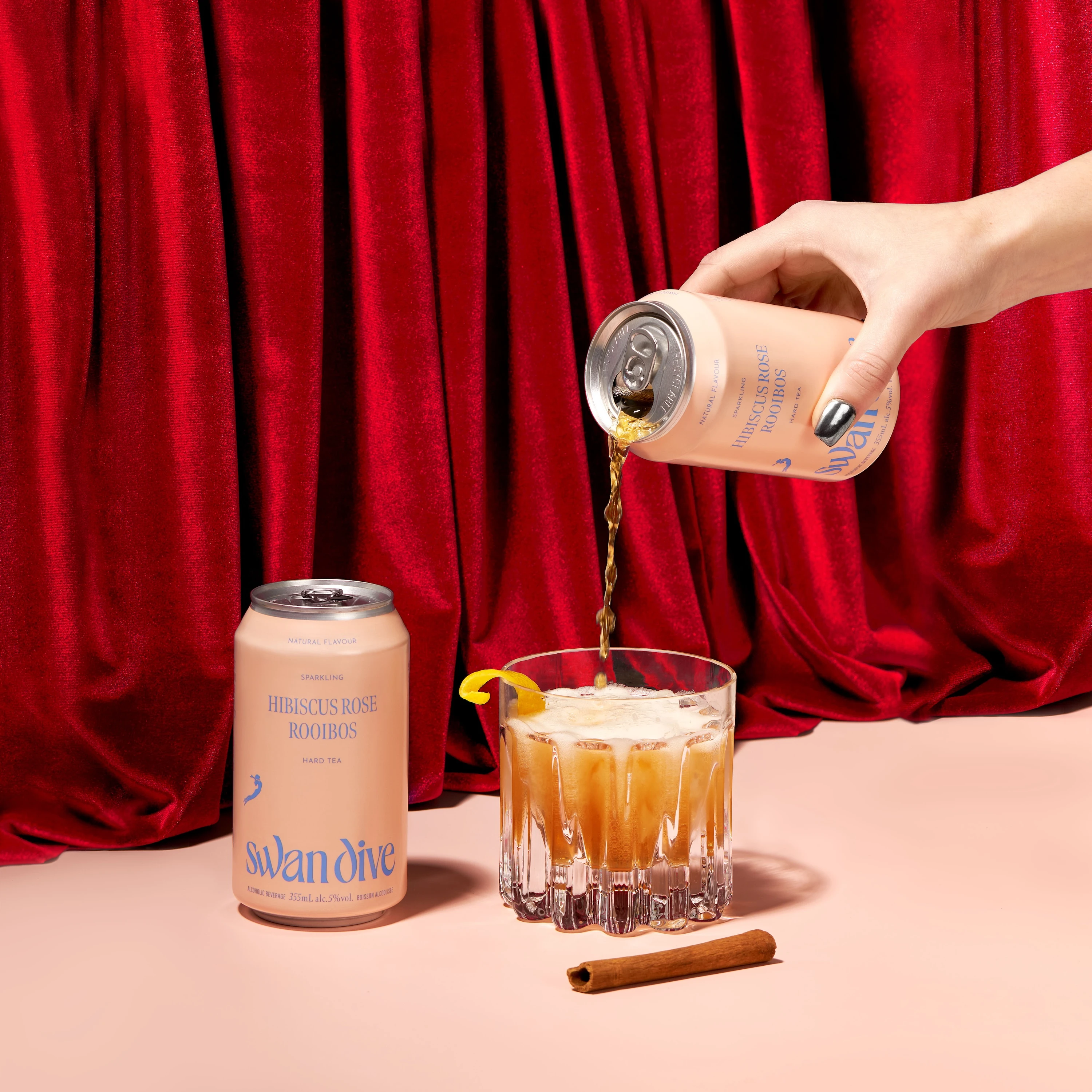 A can of beer is poured into a glass.