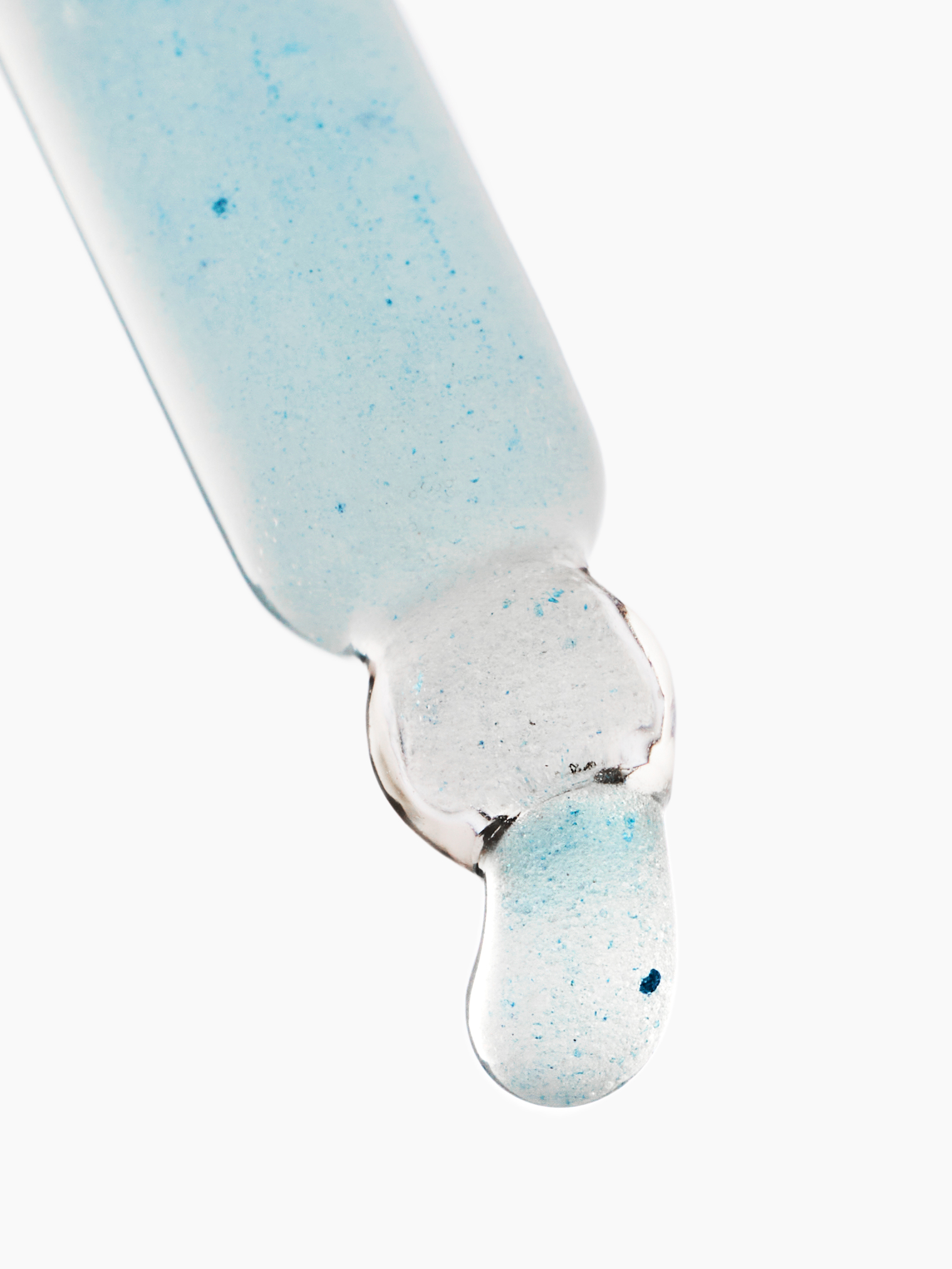 A blue bottle of liquid with a blue cap.