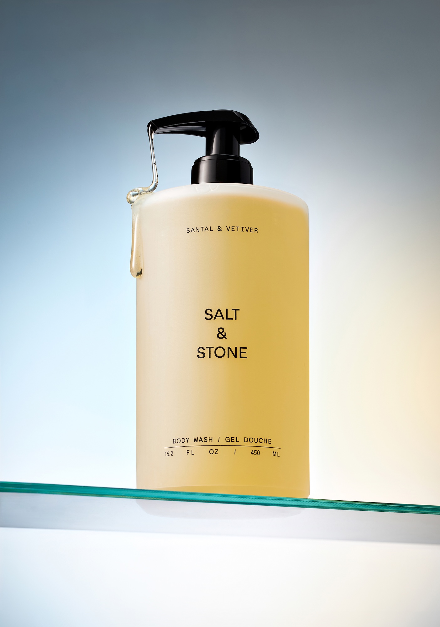 A bottle of salt and stone body wash.