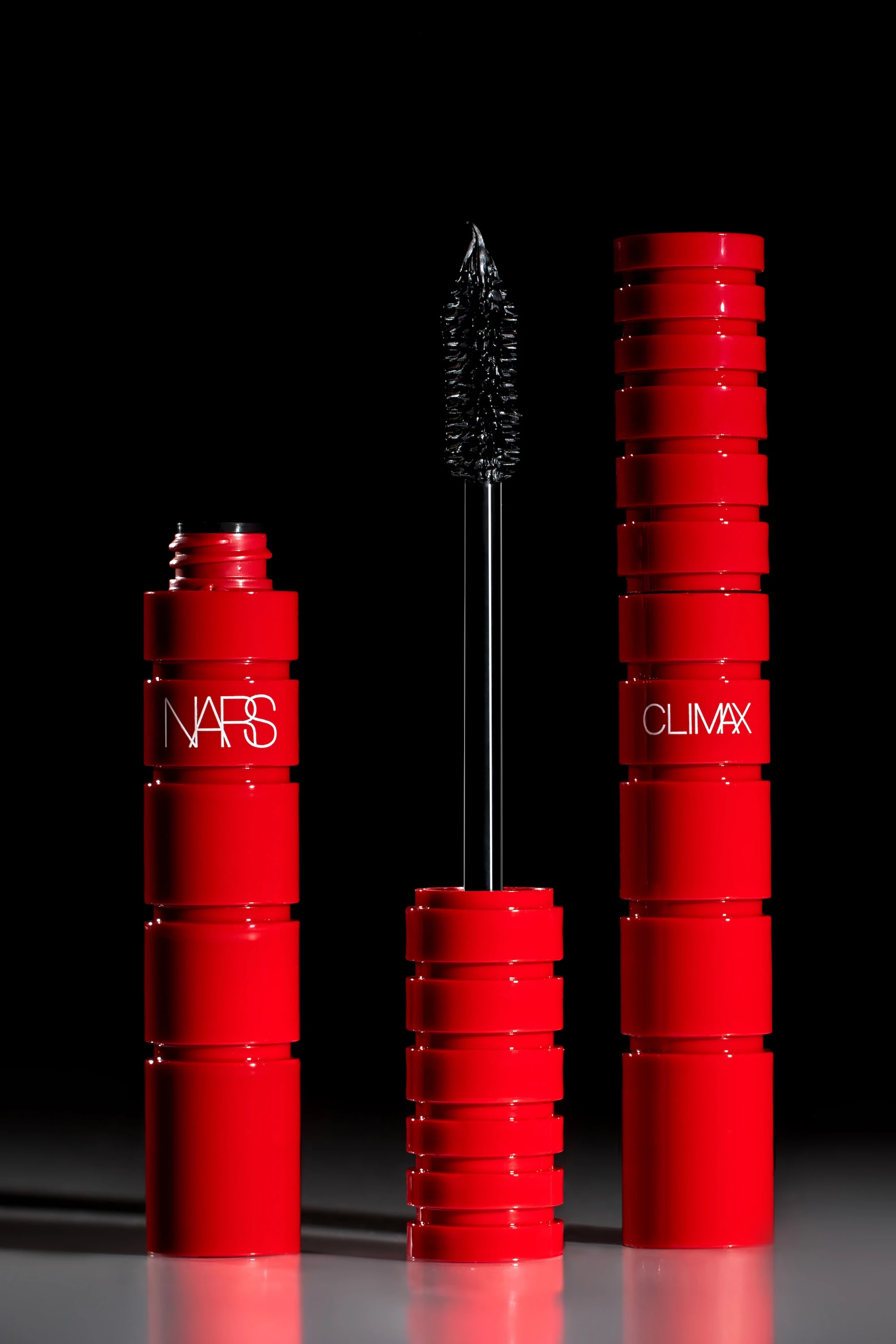 A red bottle of Climax mascara.