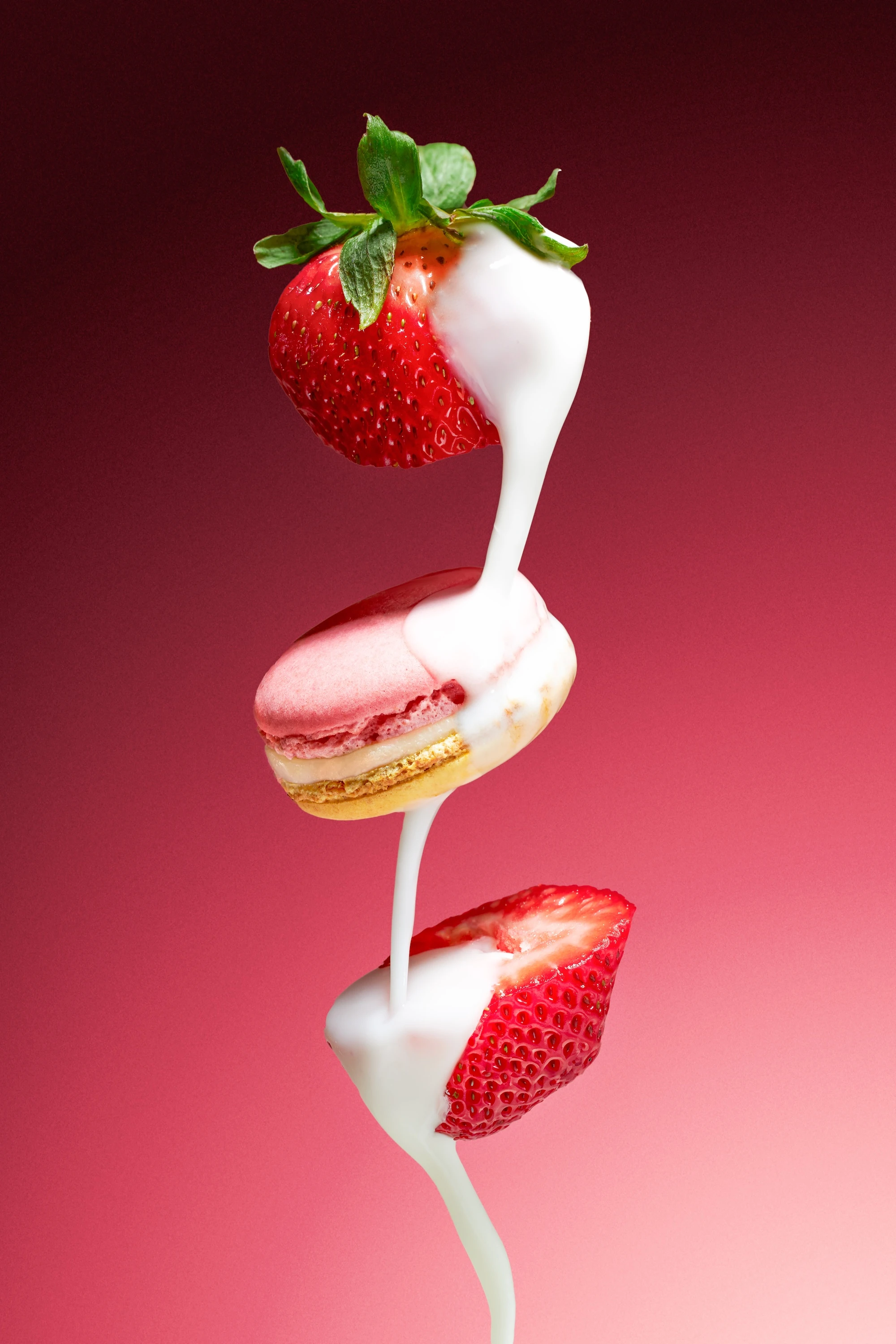 A stack of strawberries with whipped cream on top.